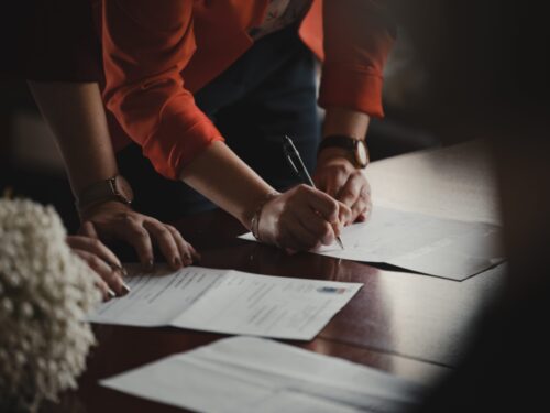 couple signing papers