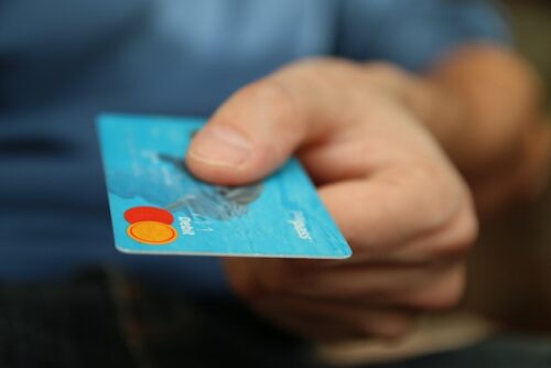 person holding credit card