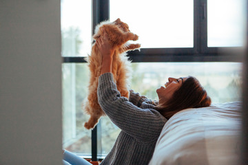 woman holding pet dog