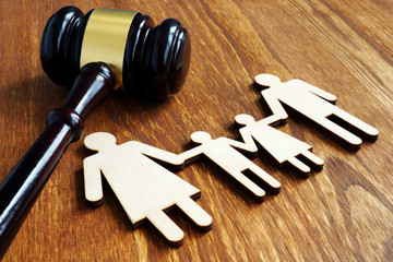 gavel and carboard cutout of family