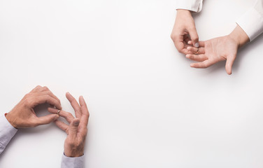 hands taking rings off