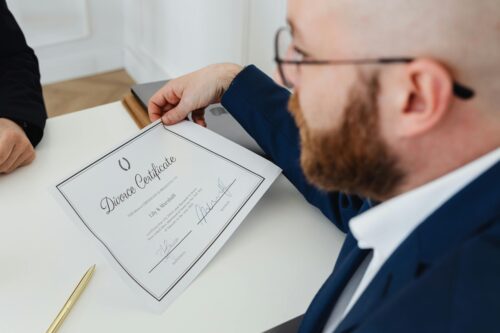 man with divorce certificate